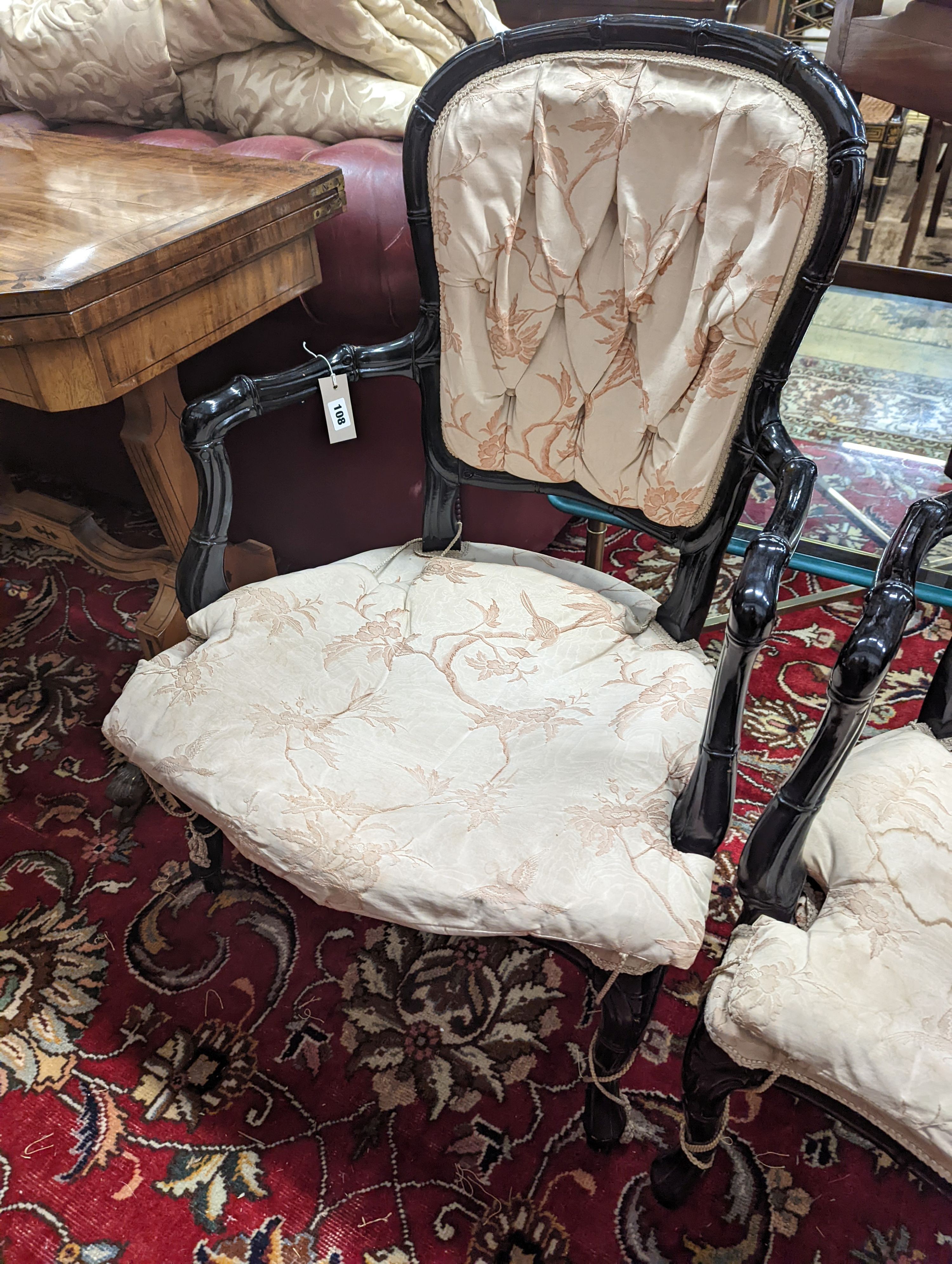 A pair of ebonised simulated bamboo open armchairs, width 59cm, depth 54cm, height 90cm